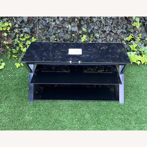 Used Glass and Metal Frame Entertainment Center for sale on AptDeco