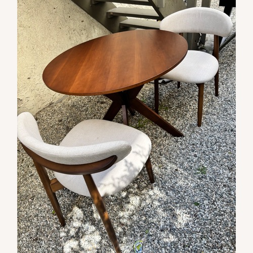 Used Light Brown Wood Dining Set for sale on AptDeco