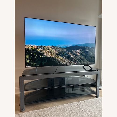 Used Large Glass Grey Silver TV Television Stand for sale on AptDeco