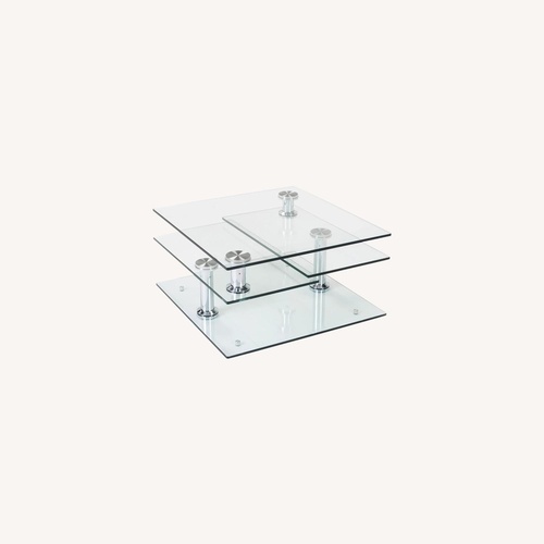 Used Raymour & Flanigan Transparent Glass Coffee Table for sale on AptDeco