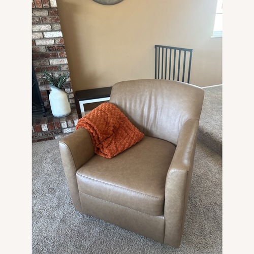 Used Ashley Furniture Bradney Leather Swivel Accent Chair for sale on AptDeco