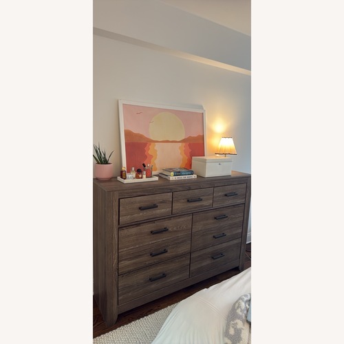 Used Ashley Furniture Zelen Dark Brown Wood Veneer Dresser for sale on AptDeco