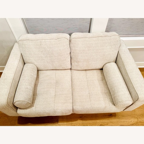 Used Ashley Furniture Hazela White Loveseat for sale on AptDeco
