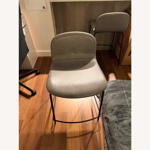 Used CB2 Primitivo Grey Counter Stools (2) for sale on AptDeco