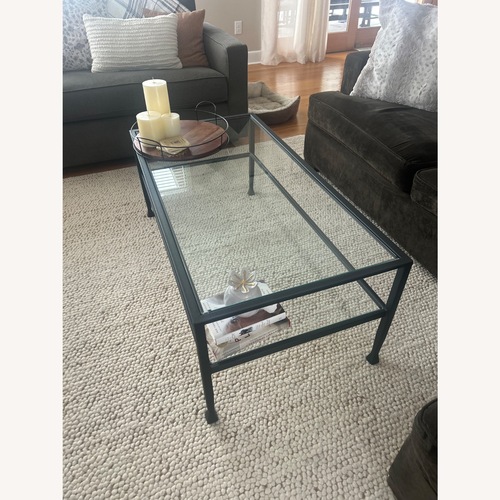 Used Pottery Barn Tanner Black Glass Coffee Table for sale on AptDeco