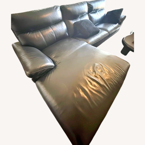 Used Black Leather 2 Piece Sectional for sale on AptDeco