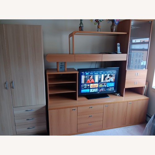Used Light Brown Wood TV Cabinet for sale on AptDeco