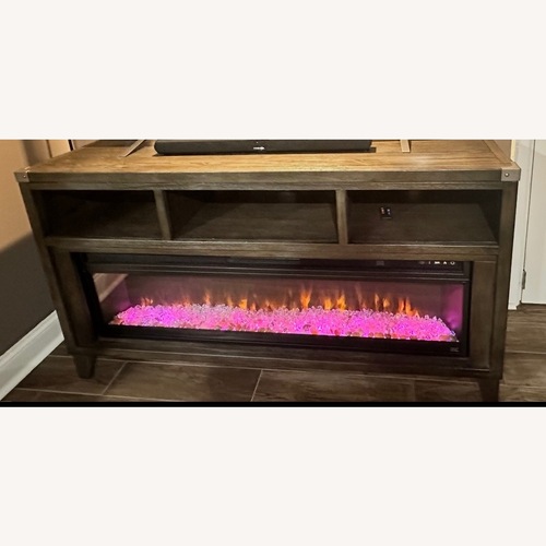 Used Ashley Furniture Todoe 65" TV Stand with Electric Fireplace for sale on AptDeco