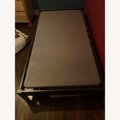 Used Dark Gray Wood Twin Bed for sale on AptDeco