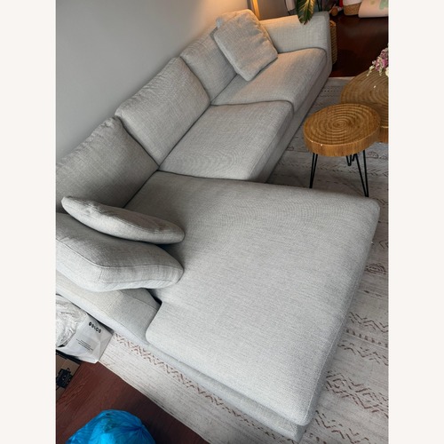 Used Ashley Furniture Sofa Light Brown 3 + Right chaise for sale on AptDeco