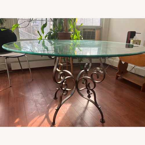 Used  Beveled Glass Top Iron Base Dining Table for sale on AptDeco
