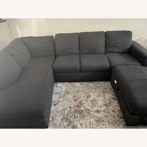 Used 2 Piece U-Shaped Sectional & Ottoman for sale on AptDeco