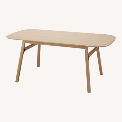 Used IKEA Voxlöv Yellow Bamboo Dining Table for sale on AptDeco