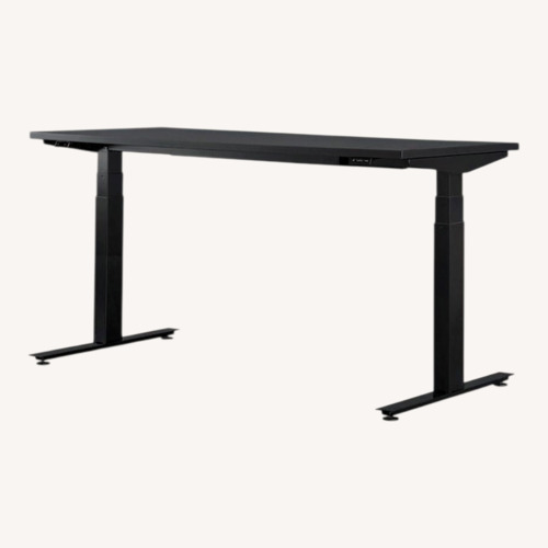Used Herman Miller Black Sit Stand Desk with Motorized Lift Desk for sale on AptDeco