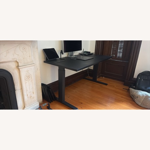 Used Herman Miller Black Sit Stand Desk with Motorized Lift Desk for sale on AptDeco