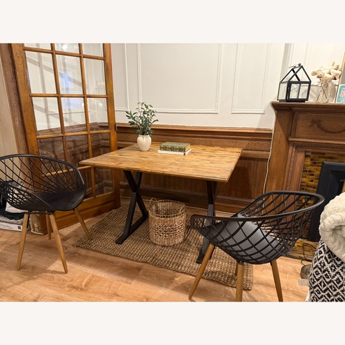 Used CB2 Sidera Black Wood Dining Chairs, Set of 2  for sale on AptDeco