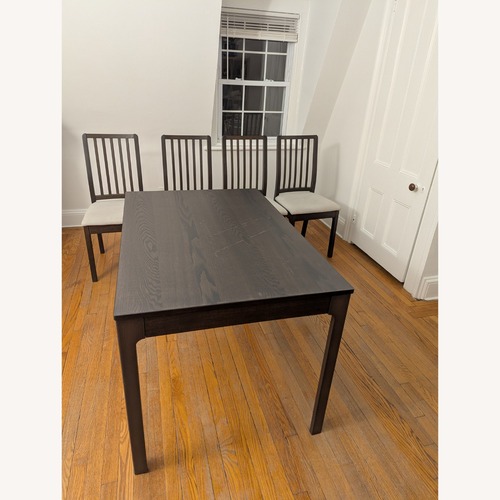 Used IKEA Dark Brown Wood Dining Table for sale on AptDeco
