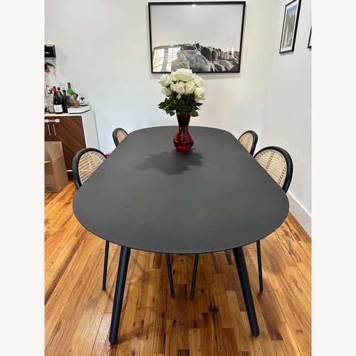 Used Article Ballo Black Aluminum Dining Table for sale on AptDeco