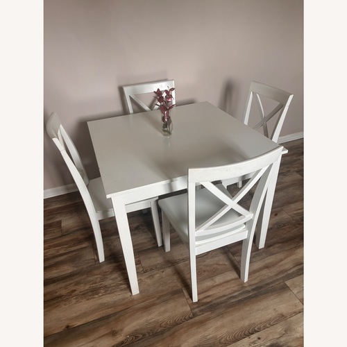 Used Simplicity White Heavy Kitchen Table and 4 Chairs for sale on AptDeco