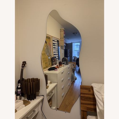 Used Wavy Glass Wall Mirror for sale on AptDeco