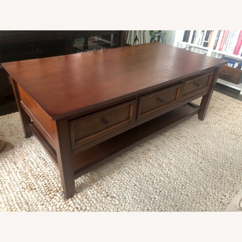 Used Pier 1 Imports Ashington Mahogany Coffee Table for sale on AptDeco