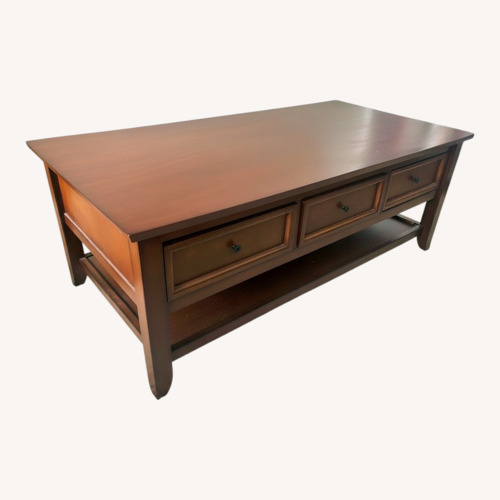 Used Pier 1 Imports Ashington Mahogany Coffee Table for sale on AptDeco