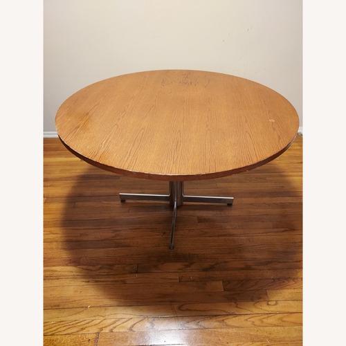 Used Raymour & Flanigan Dark Brown Wood Dining Table for sale on AptDeco