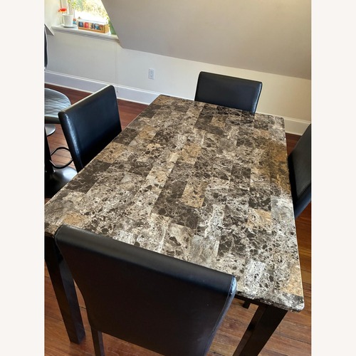 Used Raymour & Flanigan Black Dining Table for sale on AptDeco