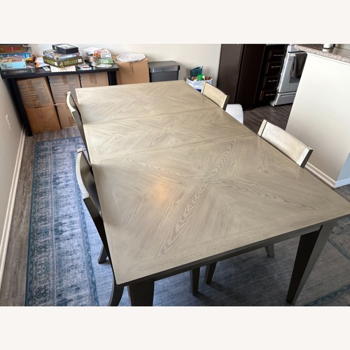 Used Macy's Tribeca Light Gray Dining Table + Chairs for sale on AptDeco