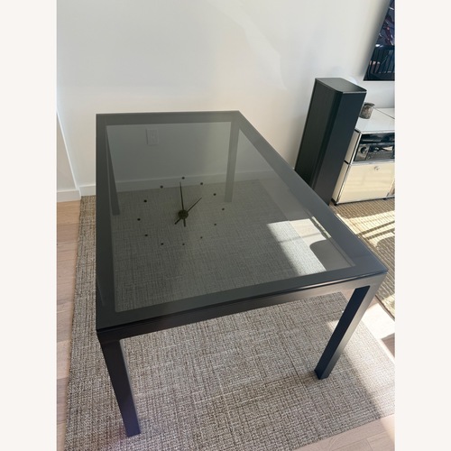Used Room & Board Parsons Black Glass Dining Table for sale on AptDeco