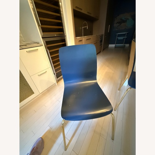 Used Anthropologie Blue Wood Dining Chairs for sale on AptDeco