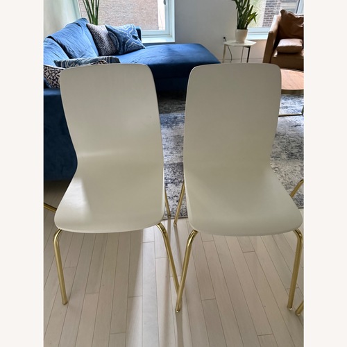 Used Anthropologie Solid Tasmin White Wood Dining Chairs for sale on AptDeco