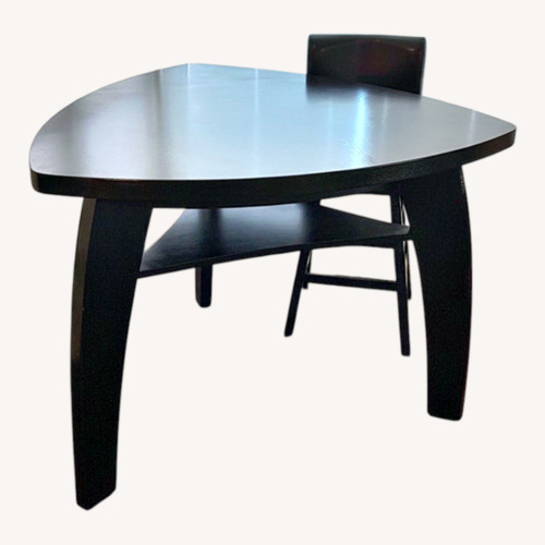 Used Dark Brown Wood Dining Table for sale on AptDeco