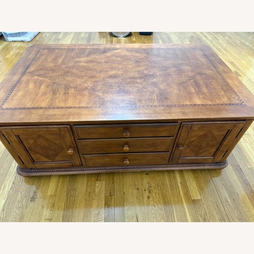 Used Huffman Koos Solid Wood Coffee Table  for sale on AptDeco