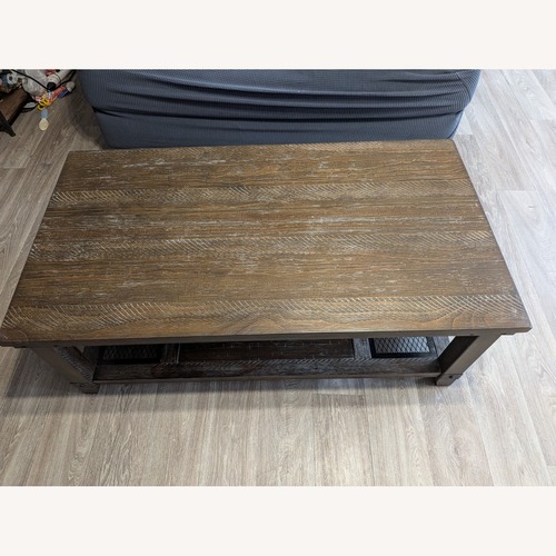Used Dark Brown Wood Coffee Table for sale on AptDeco