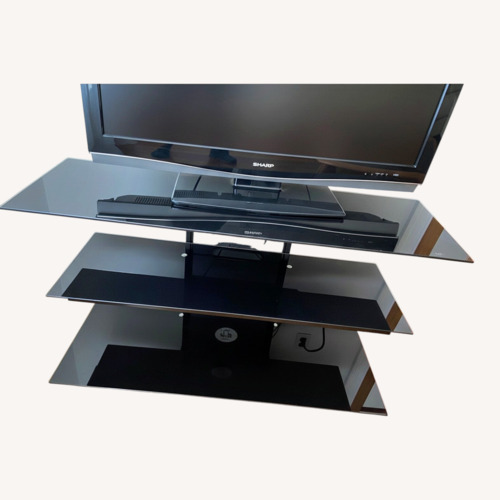 Used Black Glass Tv Stand for sale on AptDeco