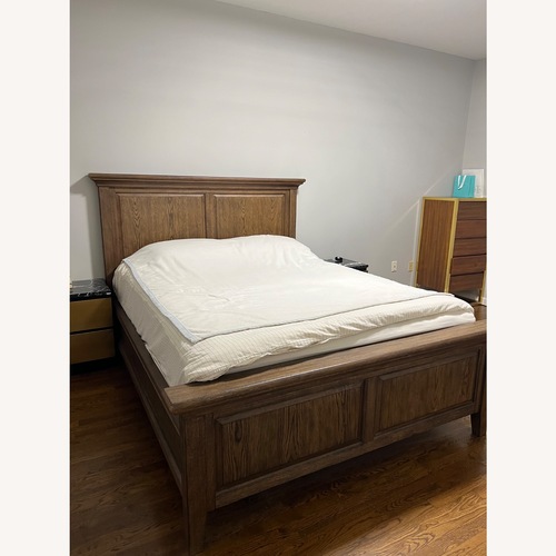 Used Pottery Barn Hudson Dark Brown Wood Queen Bed for sale on AptDeco