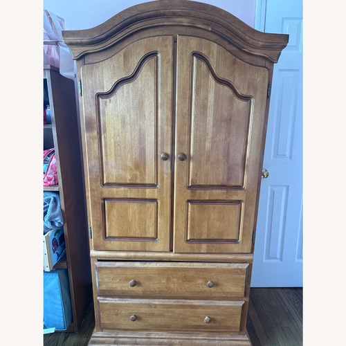 Used Bellini Furniture Light Brown Wood Armoire for sale on AptDeco