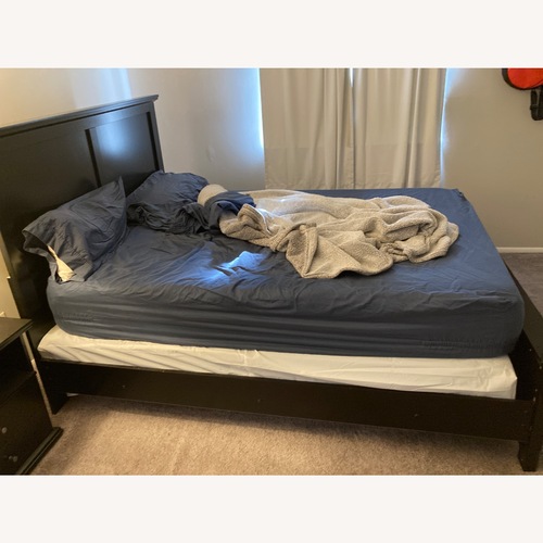 Used Ashley Furniture Dark Brown Wood Queen Bed for sale on AptDeco