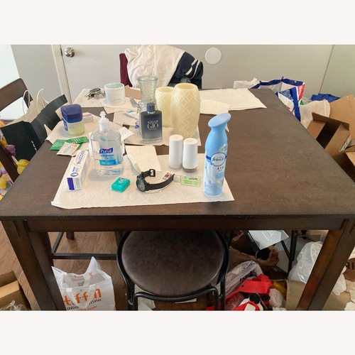 Used Ashley Furniture Dark Brown Wood Dining Table for sale on AptDeco