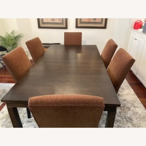 Used Crate & Barrel Dark Brown Wood Dining Table for sale on AptDeco