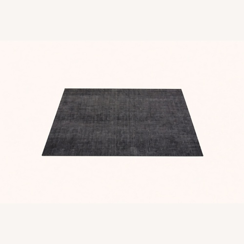 Used Crate & Barrel Black Wool Blend Area Rug 5' x 8' for sale on AptDeco