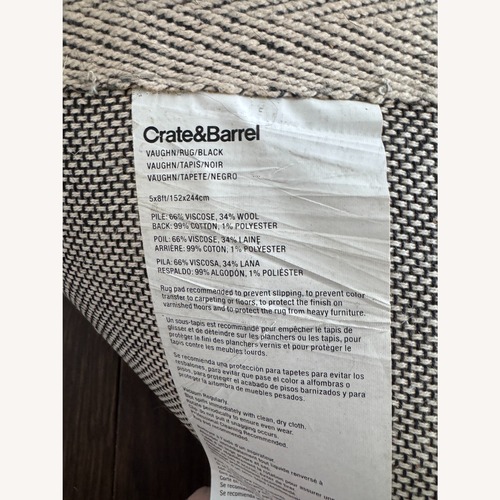 Used Crate & Barrel Black Wool Blend Area Rug 5' x 8' for sale on AptDeco