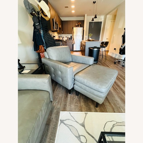 Used Macy's Locasta Gray Leather Armchair With Ottoman for sale on AptDeco