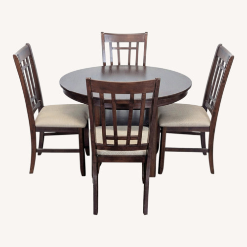Used Dark Wood 5-Piece Round Extendable Dining Set  for sale on AptDeco