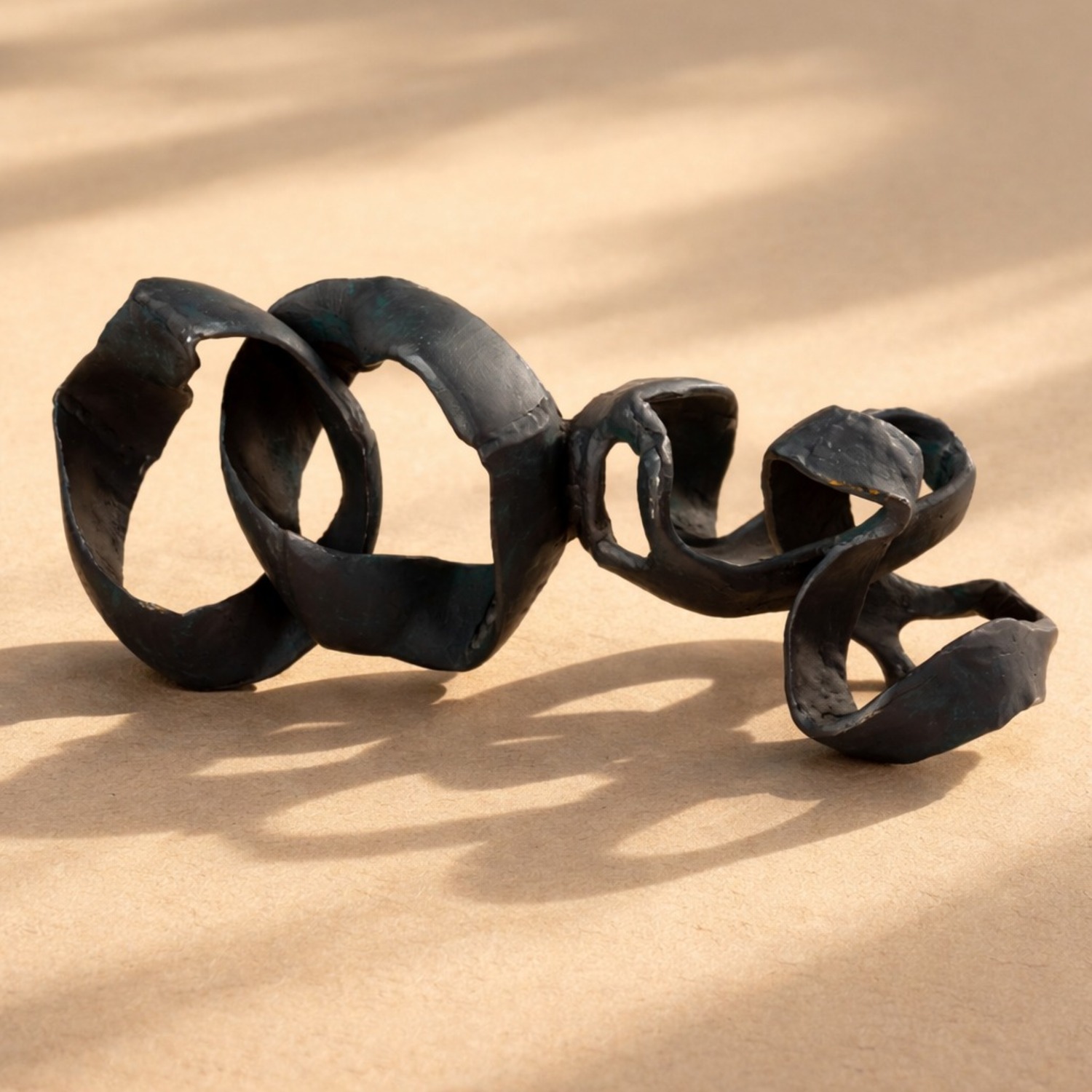 CB2 Black Aluminum Ribbon Table Sculpture - image-1