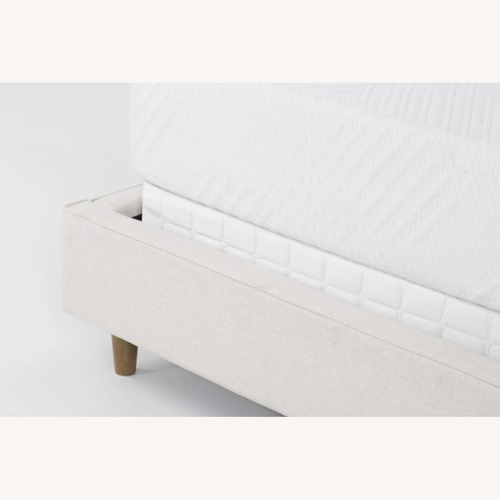 Used Living Spaces Upholstered Queen Bedframe for sale on AptDeco
