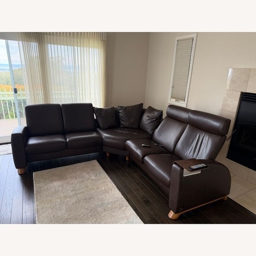 Used Stressless Brown Leather Sectional Sofa with Wood for sale on AptDeco