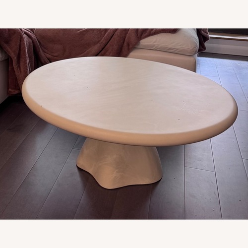 Used CB2 Espira 35" Round Cream Marbled Resin Coffee Table for sale on AptDeco