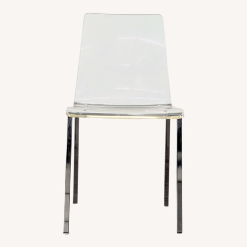 Used Clear Plastic Dining Chair on Metal Base	 for sale on AptDeco